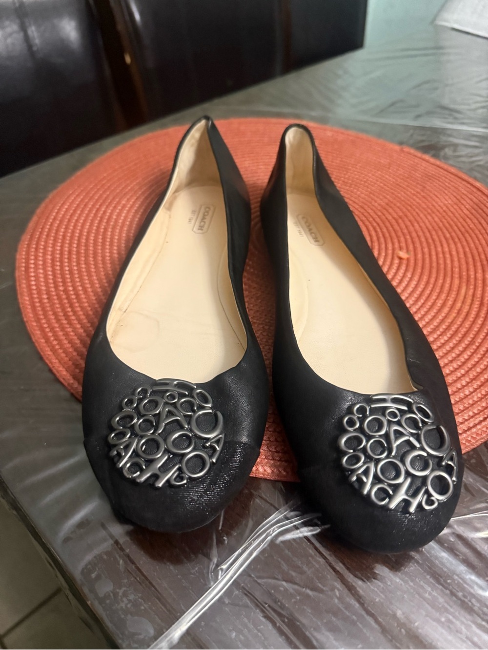 Coach Black Leather Ballet Flats with Silver Logo Medallion